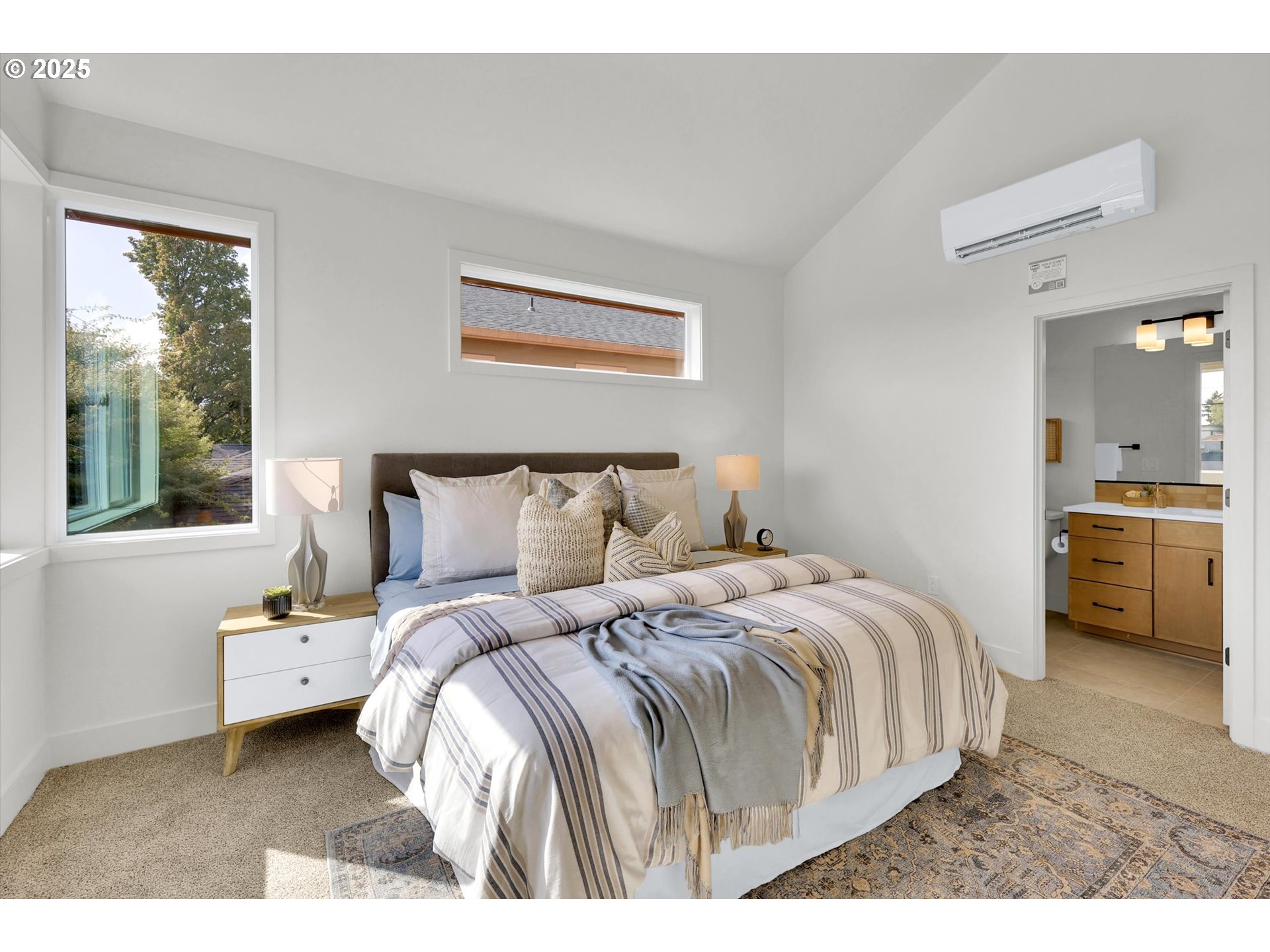 5773 South Kelly Avenue Portland, OR 97239 - Photo 23 of 33 a bedroom with a bed and a view of living room