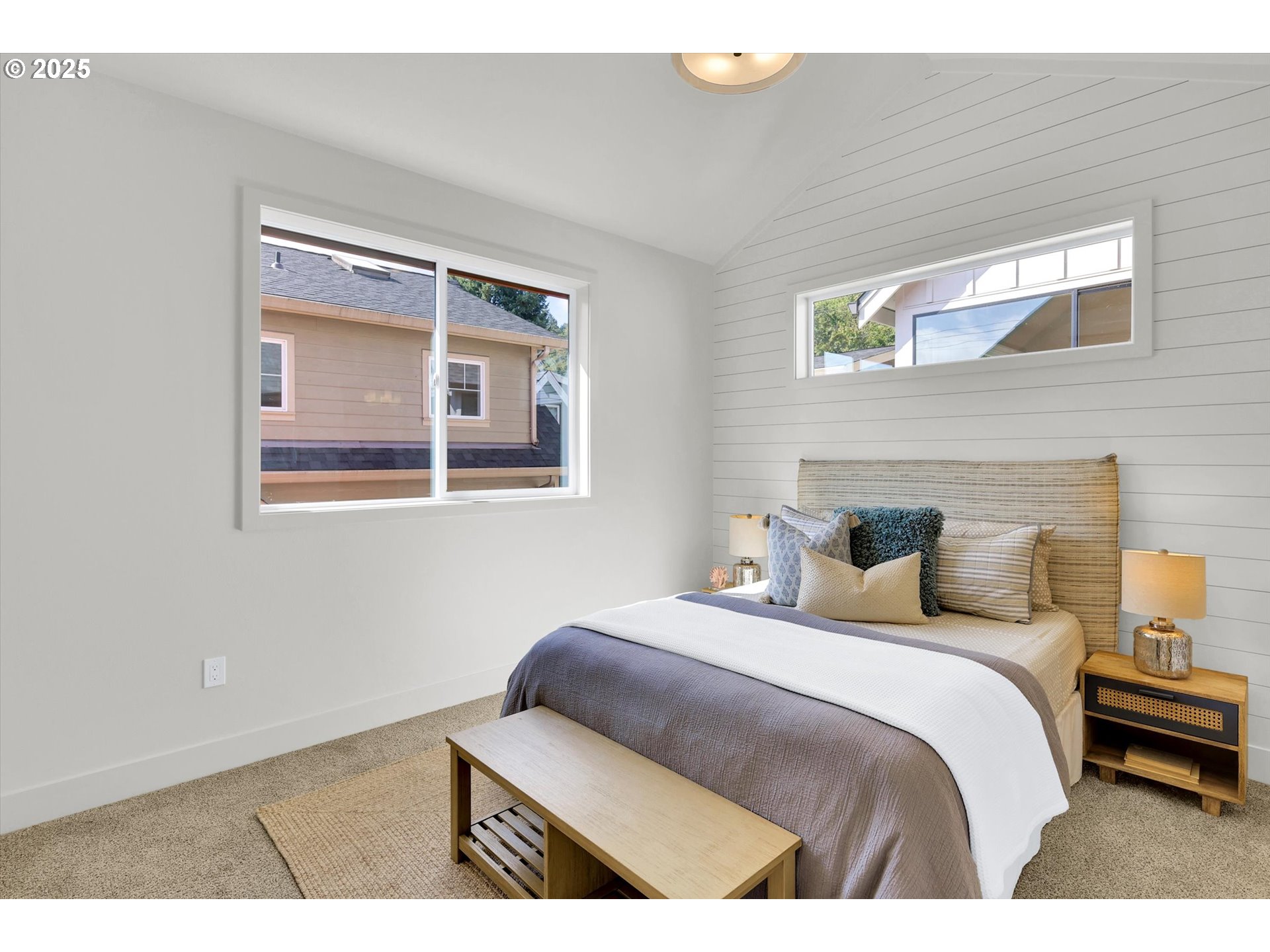 5773 South Kelly Avenue Portland, OR 97239 - Photo 26 of 33 a bedroom with a bed and a wall painting