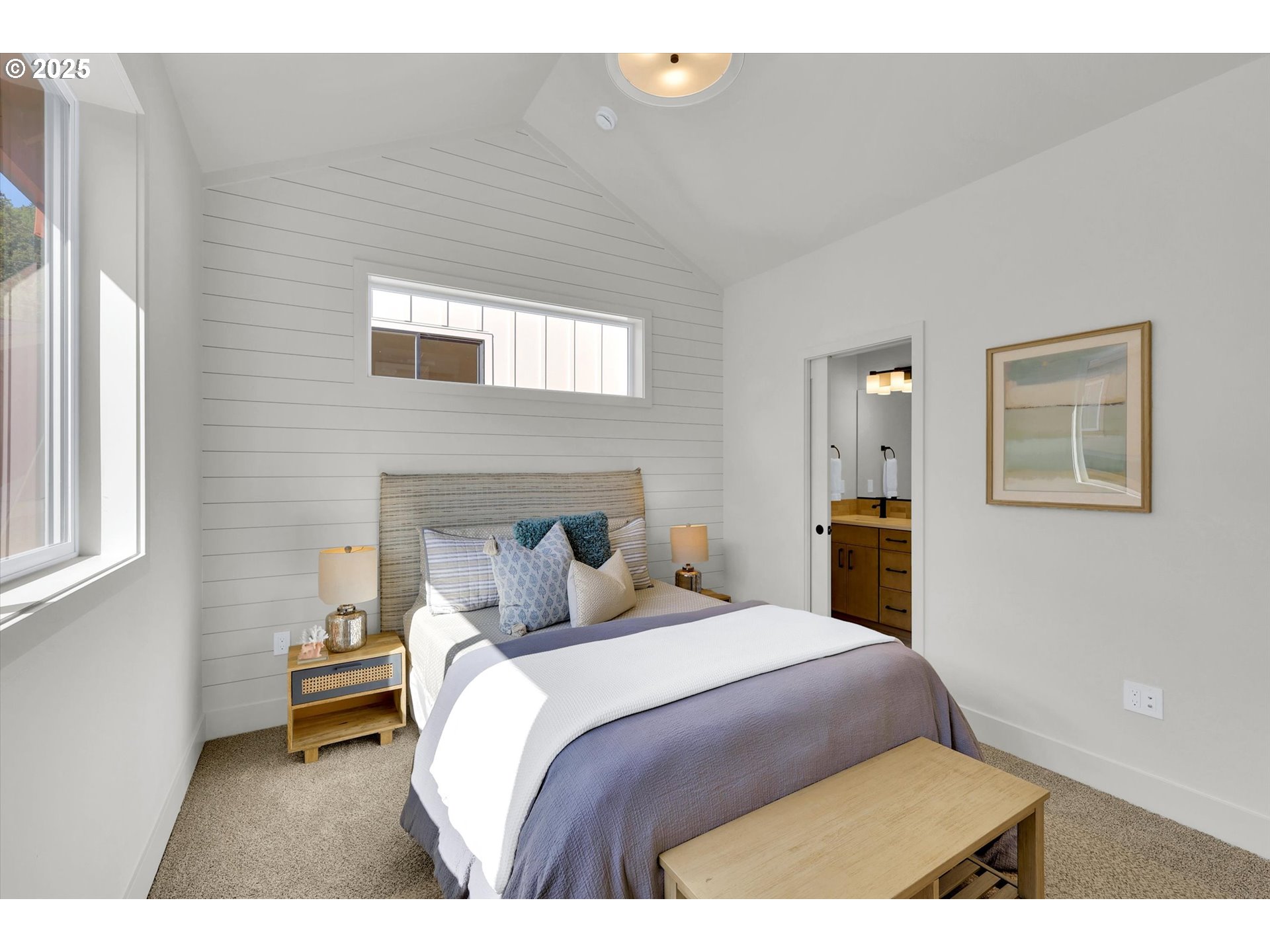 5773 South Kelly Avenue Portland, OR 97239 - Photo 27 of 33 a bedroom with a bed and a night stand