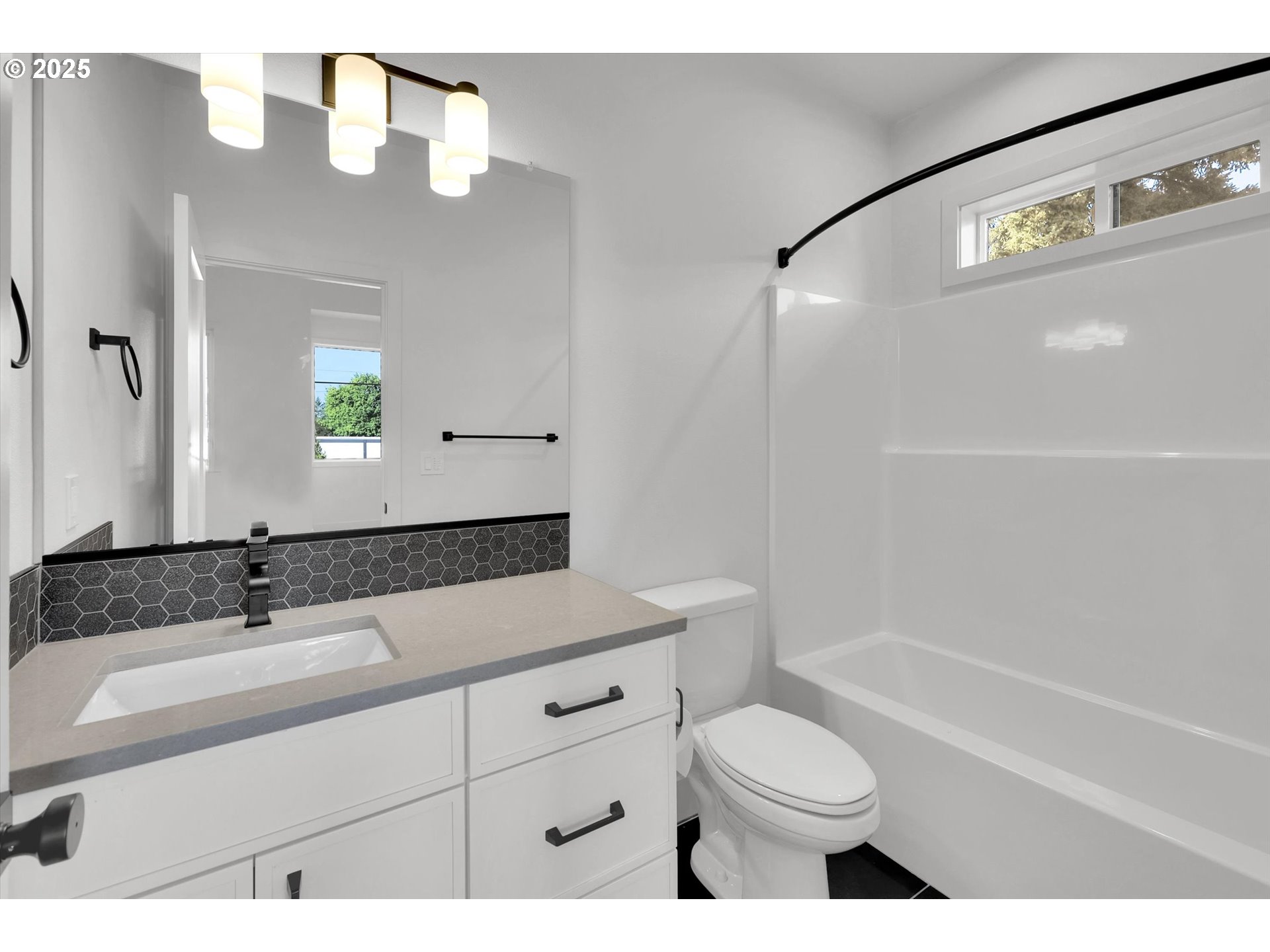 5773 South Kelly Avenue Portland, OR 97239 - Photo 33 of 33 a bathroom with a sink a toilet and shower