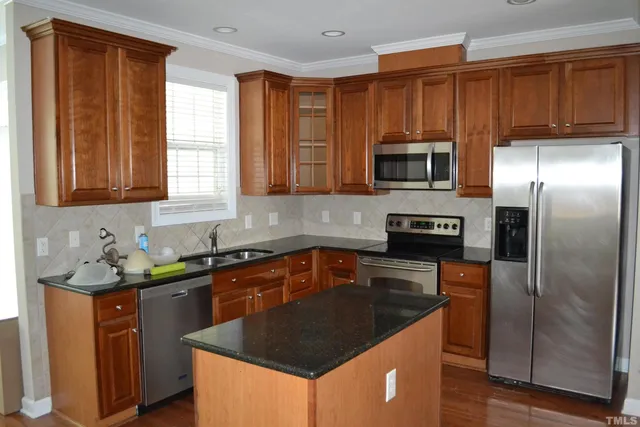 a white toilet sitting next to a small yard