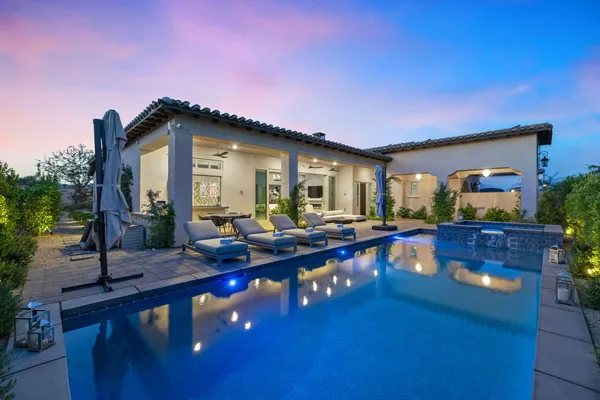 a view of swimming pool with outdoor seating