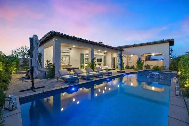 a view of swimming pool with outdoor seating