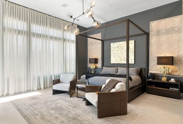 a spacious bathroom with a double vanity sink and mirror