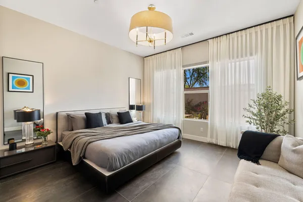 a bathroom with a granite countertop sink and a toilet
