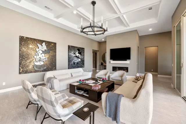 a view of a dining room with furniture wooden floor and chandelier