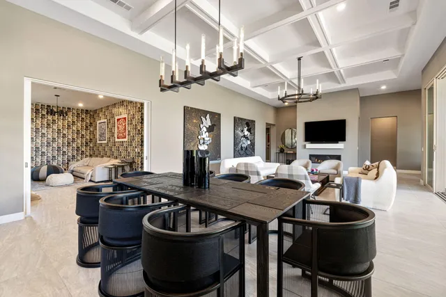 a room with a large window and wooden floor