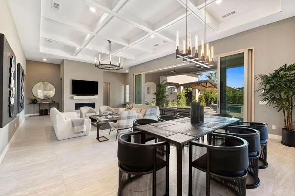 a kitchen with stainless steel appliances granite countertop a sink a stove and a refrigerator