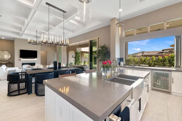a kitchen with stainless steel appliances a sink and cabinets