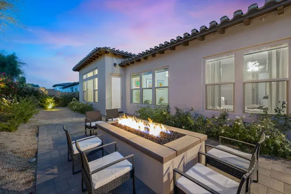 a view of a patio with couches and sky view