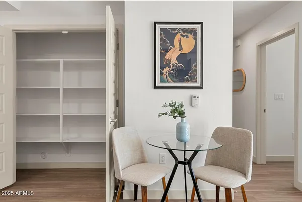 a view of a dining room with furniture and wooden floor