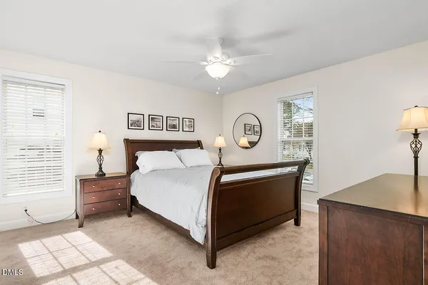 a bed room with a bed and a window