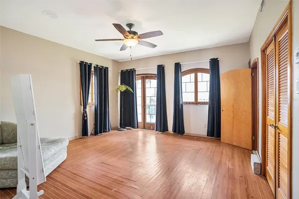 a bathroom with a granite countertop sink mirror vanity and toilet