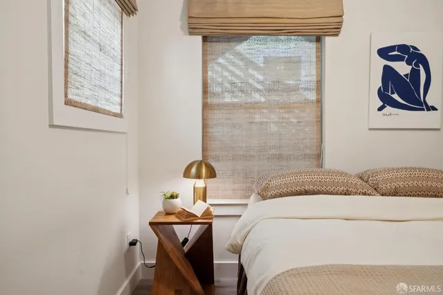 a bedroom with a bed and dresser