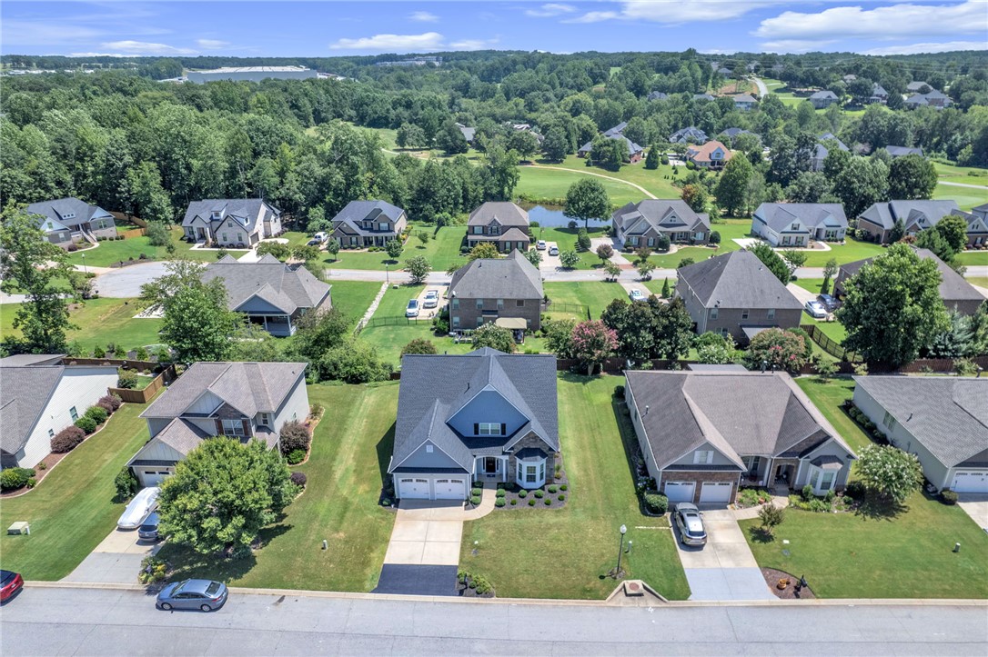 116 Stone Cottage Drive Anderson, SC 29621 - Photo 37 of 43 Aerial view showcases a beautifully planned neighborhood surrounded by lush rolling hills and mature trees.