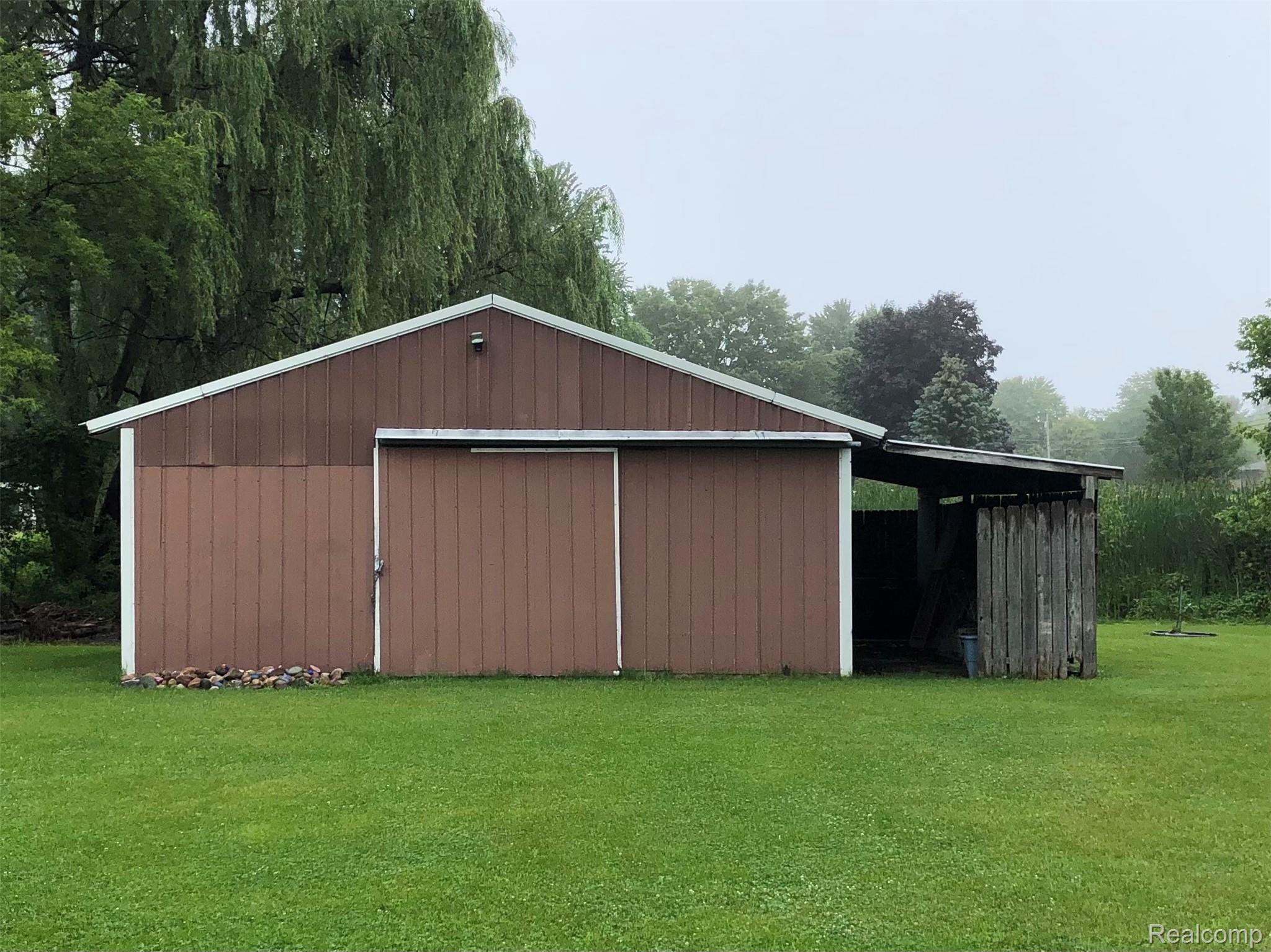 7018 Wilson Road Montrose, MI 48457 - Photo 22 of 24 Pole barn at rear of back yard