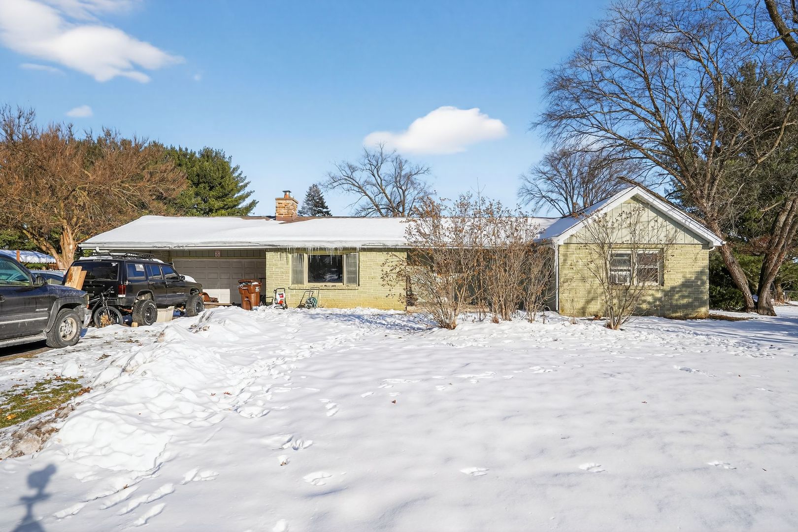 2388 McFarland Road Rockford, IL 61108 - Photo 1 of 33 a view of a house with a yard covered in snow