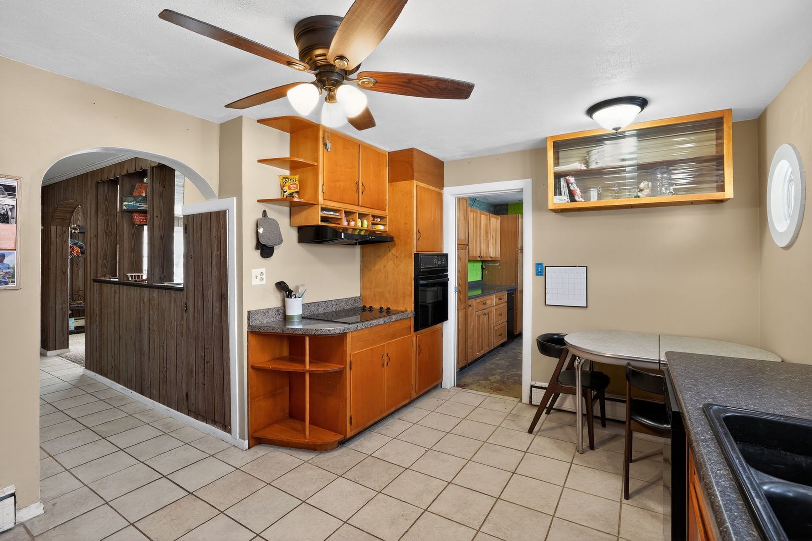 2388 McFarland Road Rockford, IL 61108 - Photo 15 of 33 a kitchen with stainless steel appliances a stove a chimney a sink and cabinets