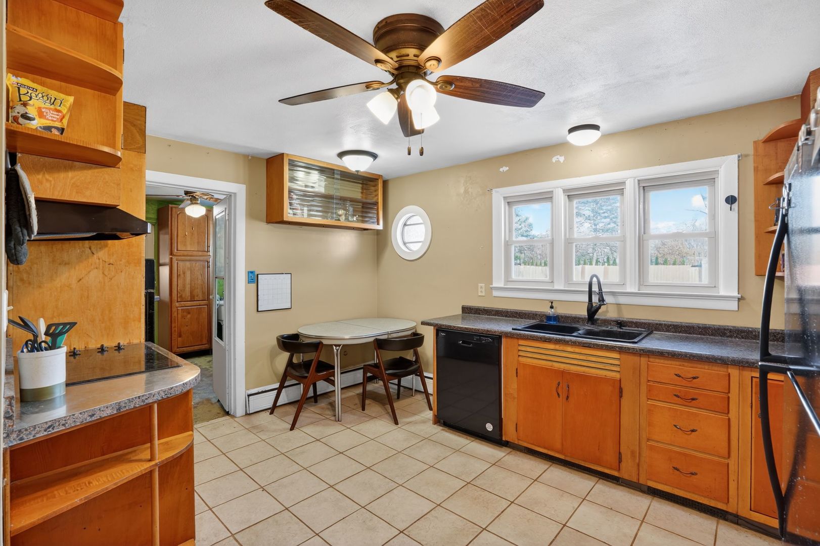 2388 McFarland Road Rockford, IL 61108 - Photo 18 of 33 a kitchen with a sink dining table and chairs