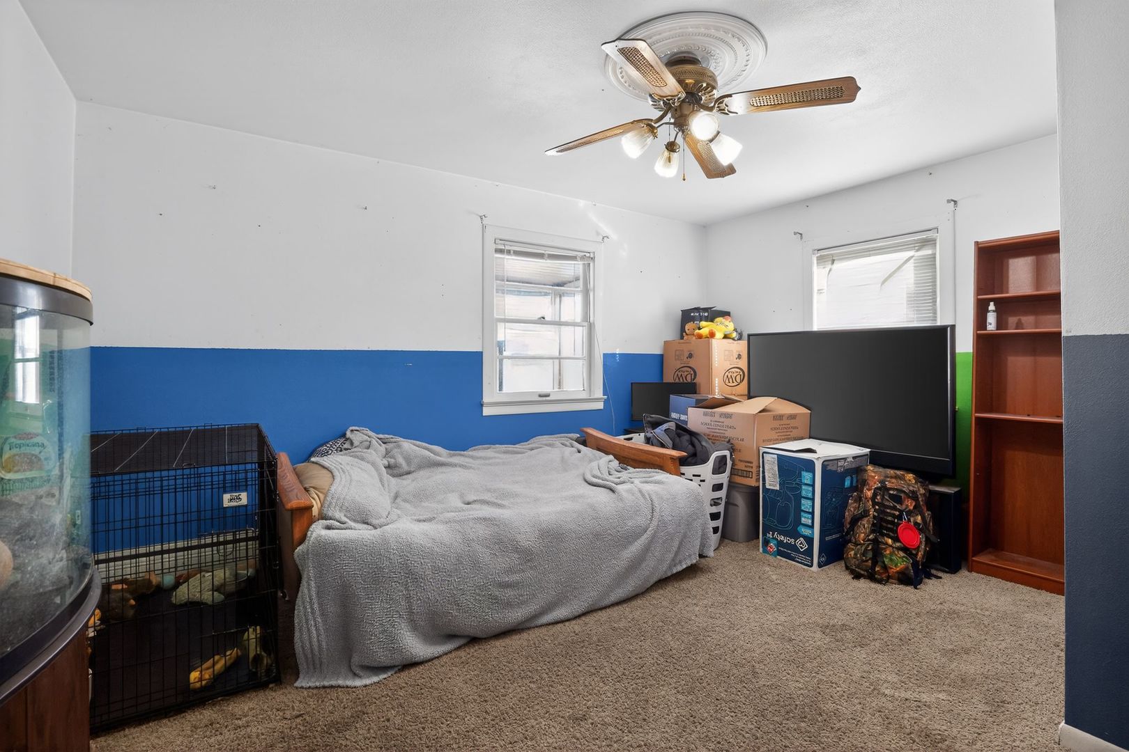 2388 McFarland Road Rockford, IL 61108 - Photo 24 of 33 a bed room with furniture and a chandelier