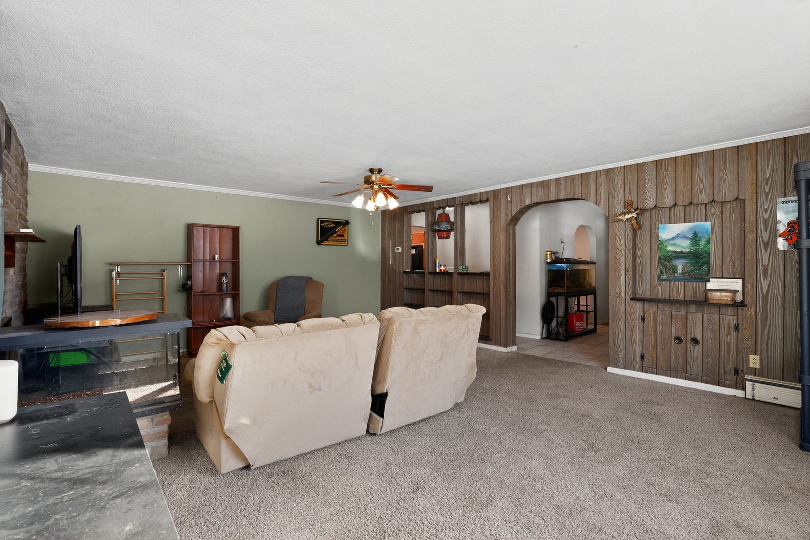 2388 McFarland Road Rockford, IL 61108 - Photo 9 of 33 a living room with furniture and a flat screen tv