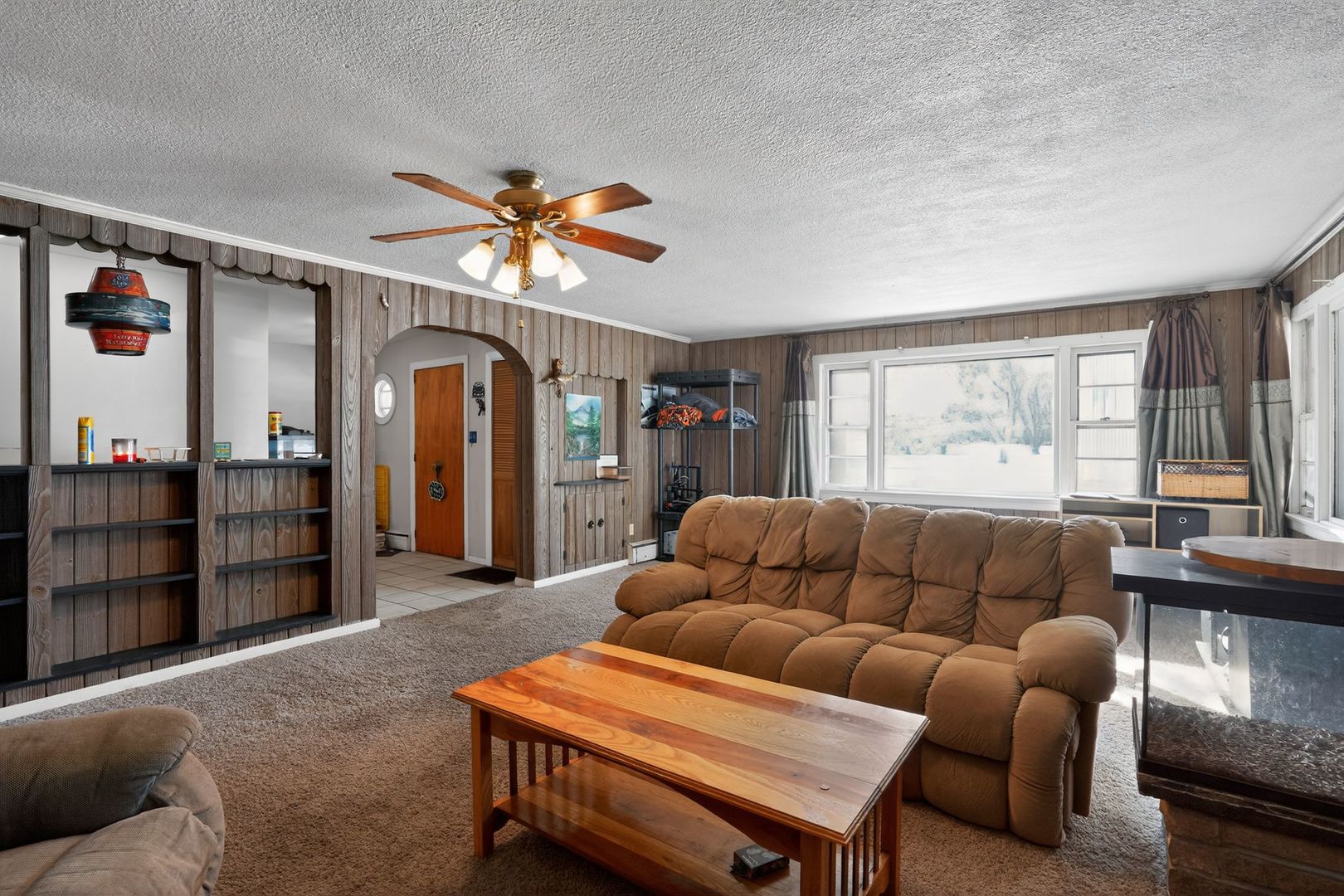 2388 McFarland Road Rockford, IL 61108 - Photo 10 of 33 a living room with furniture a ceiling fan and a window