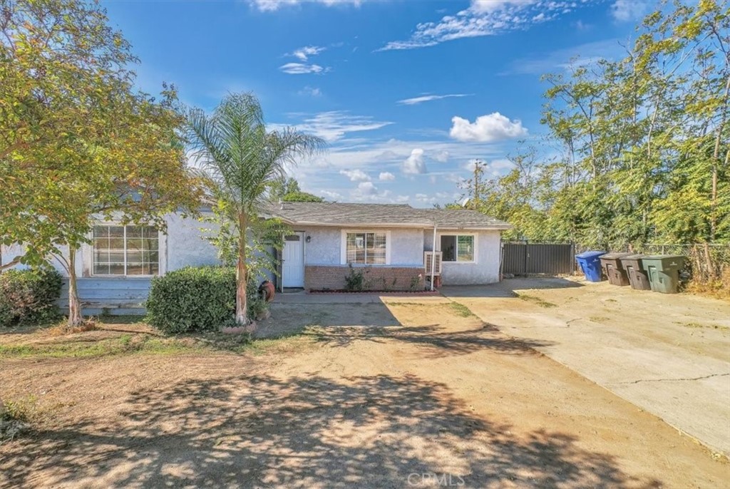 5440 Tyler Street Riverside, CA 92503 - Photo 1 of 1 a front view of a house with a yard and garage