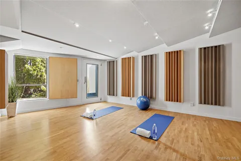 a view of an empty room with a window and storage