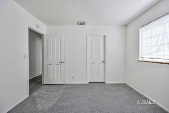 1213 Alysa Court Ridgecrest, CA 93555 - Photo 18 of 34 an empty room with windows