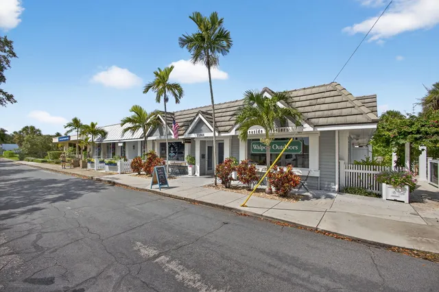 a view of a house with a patio and a fire pit