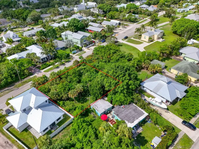 an aerial view of residential house with outdoor space and swimming pool