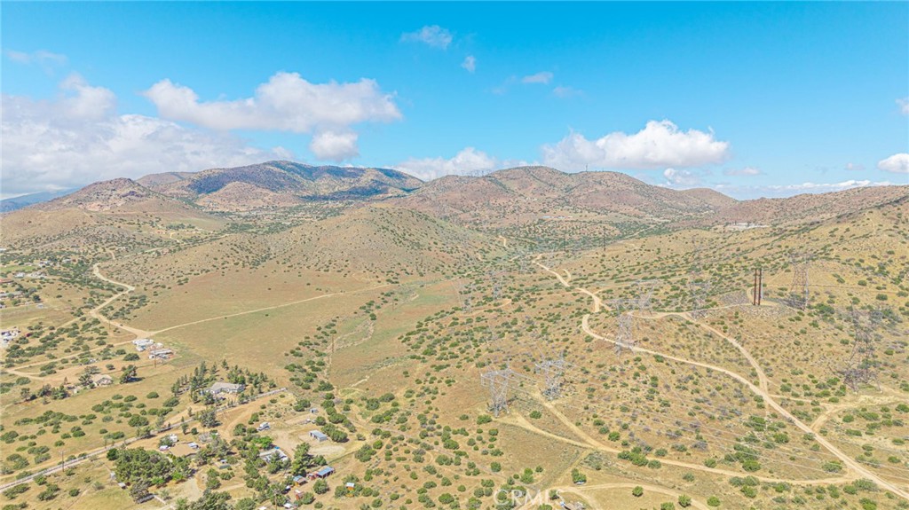 0 Tuckerway Ranch Road Palmdale, CA 93551 - Photo 13 of 19 a view of a dry yard with mountains in the background