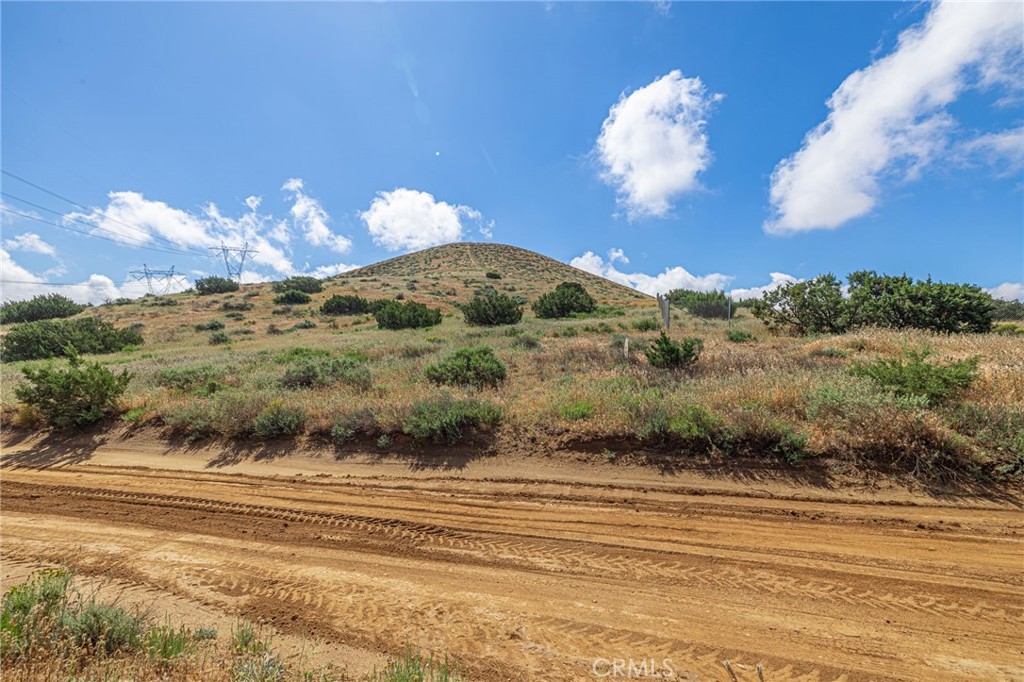 0 Tuckerway Ranch Road Palmdale, CA 93551 - Photo 15 of 19 a view of a house with a swimming pool and a yard