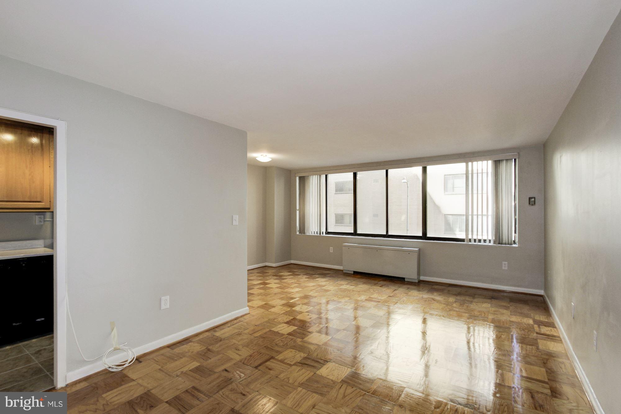 a view of an empty room with a window