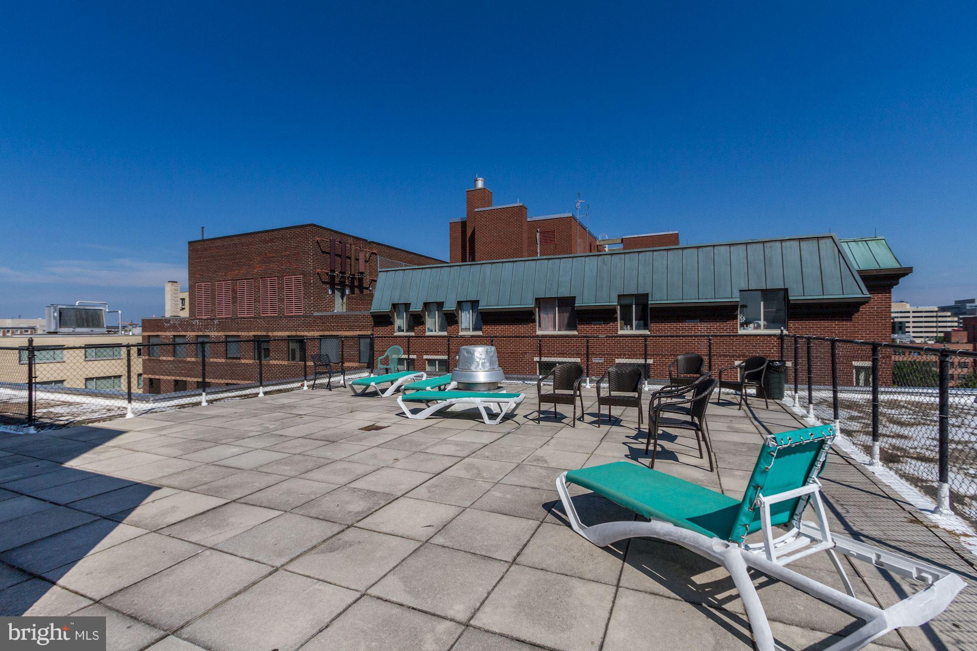 522 21st Street Northwest, Unit 301 Washington, DC 20006 - Photo 21 of 29 a view of a patio with chairs and a table