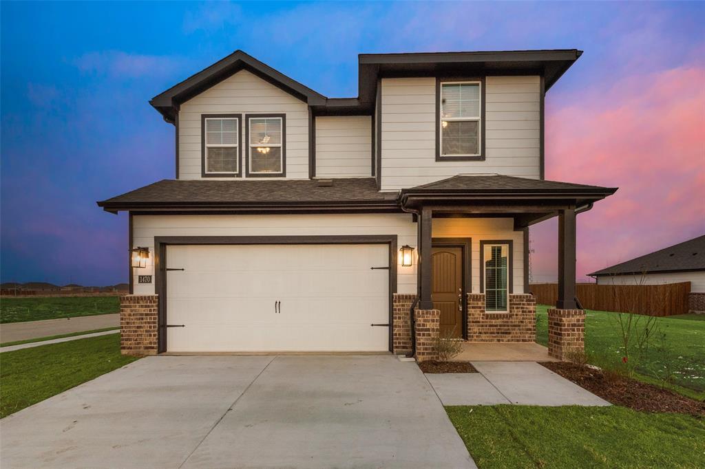 280 Sutter Mill Road Saginaw, TX 76131 - Photo 1 of 21 a front view of a house with garden
