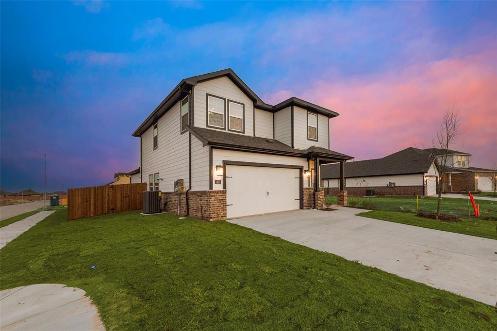 280 Sutter Mill Road Saginaw, TX 76131 - Photo 3 of 21 a front view of a house with a yard