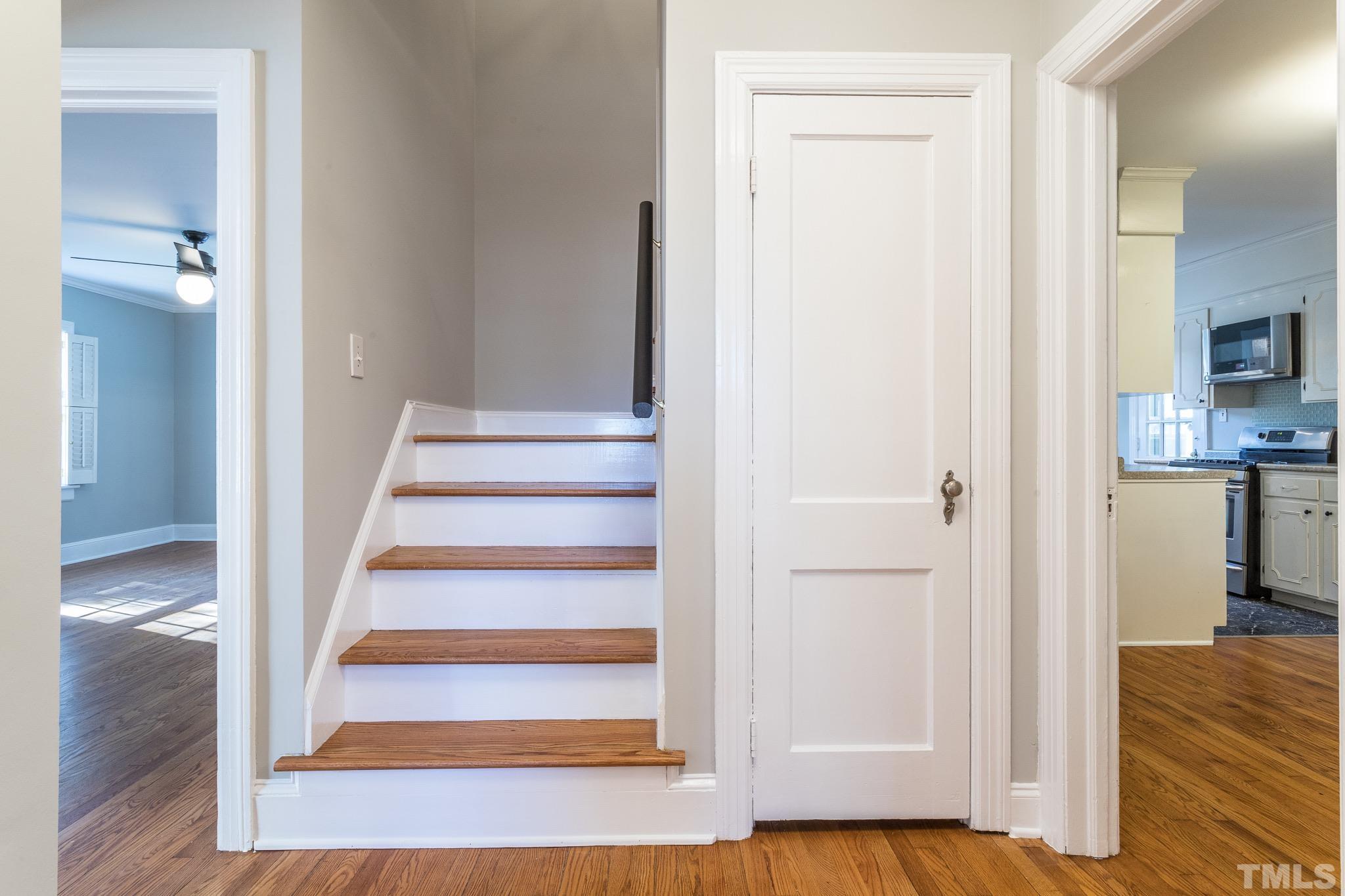 2725 Anderson Drive Raleigh, NC 27608 - Photo 14 of 27 a view of an entryway with wooden floor and a living room