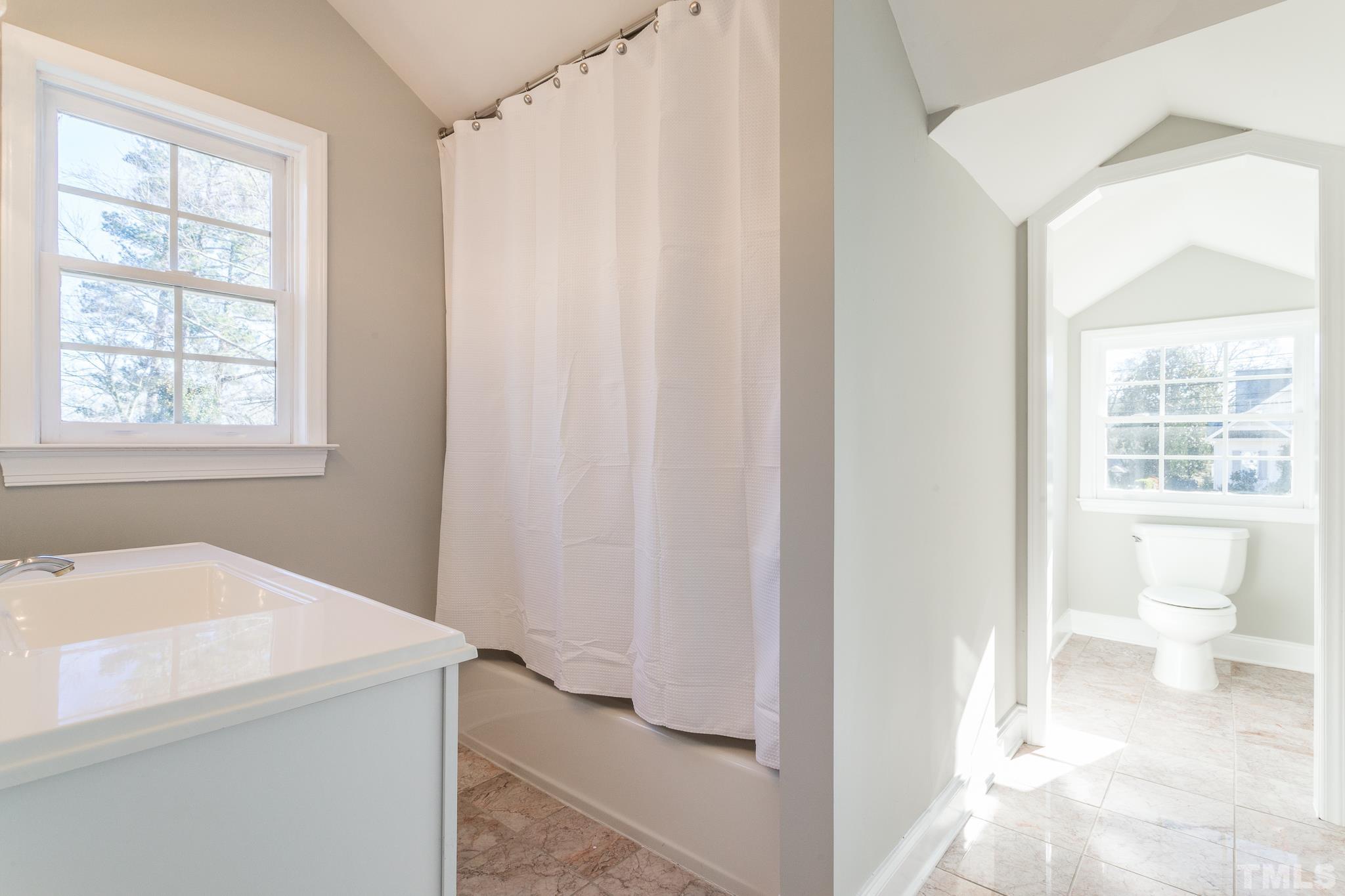 2725 Anderson Drive Raleigh, NC 27608 - Photo 18 of 27 a bathroom with a sink and a toilet