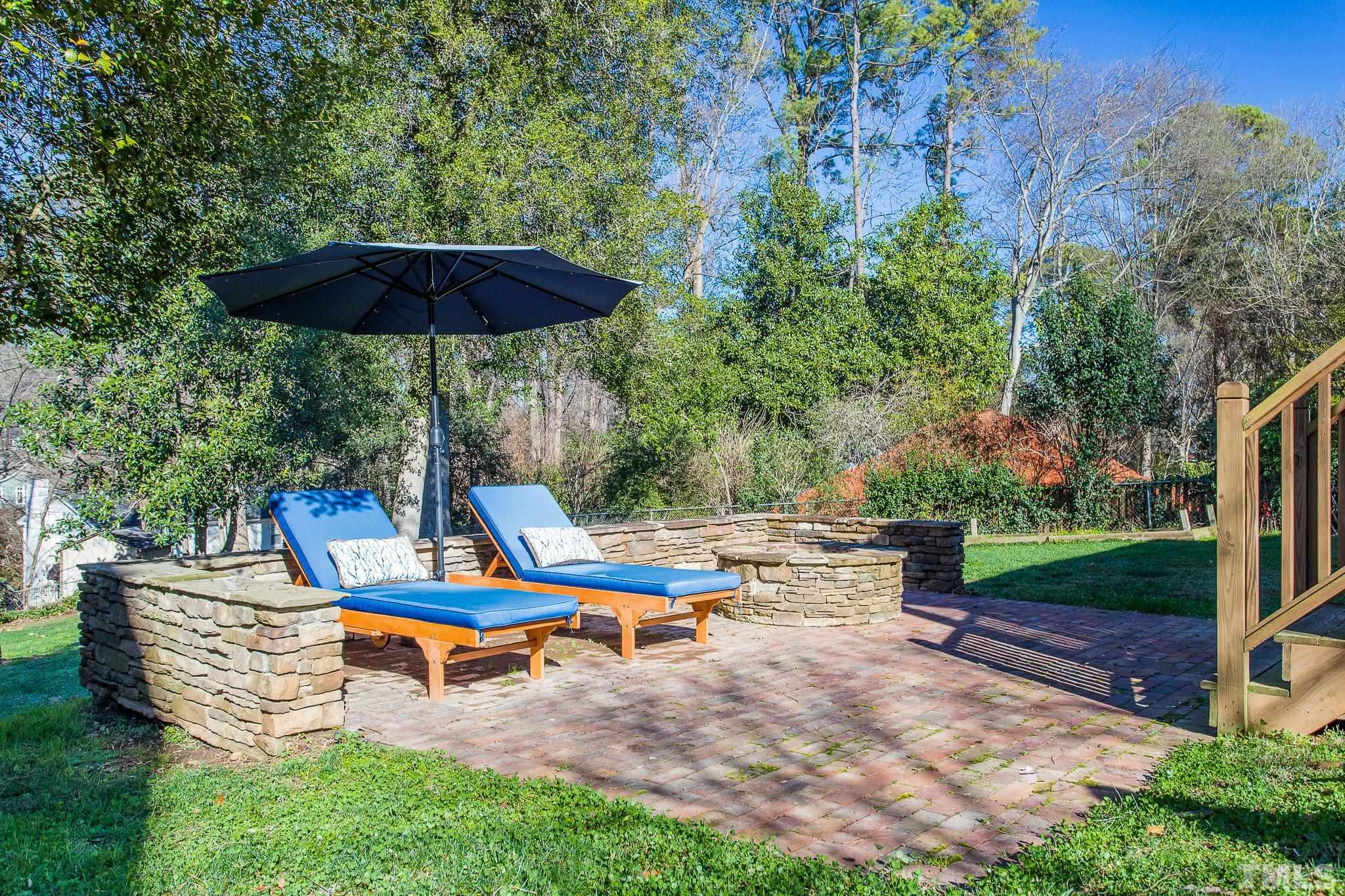 2725 Anderson Drive Raleigh, NC 27608 - Photo 23 of 27 an outdoor sitting area with chairs and wooden fence