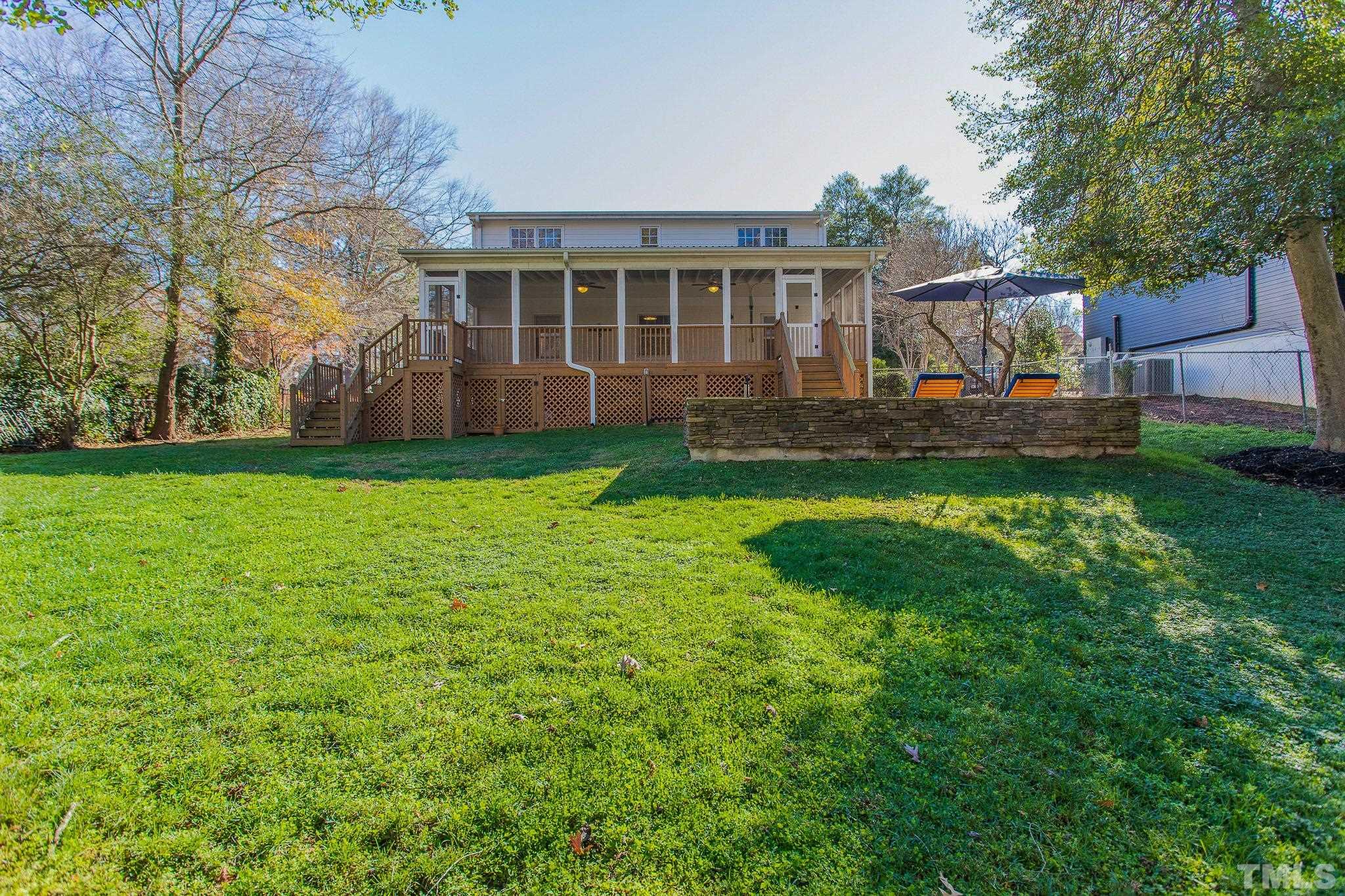 2725 Anderson Drive Raleigh, NC 27608 - Photo 24 of 27 a view of a house with a back yard