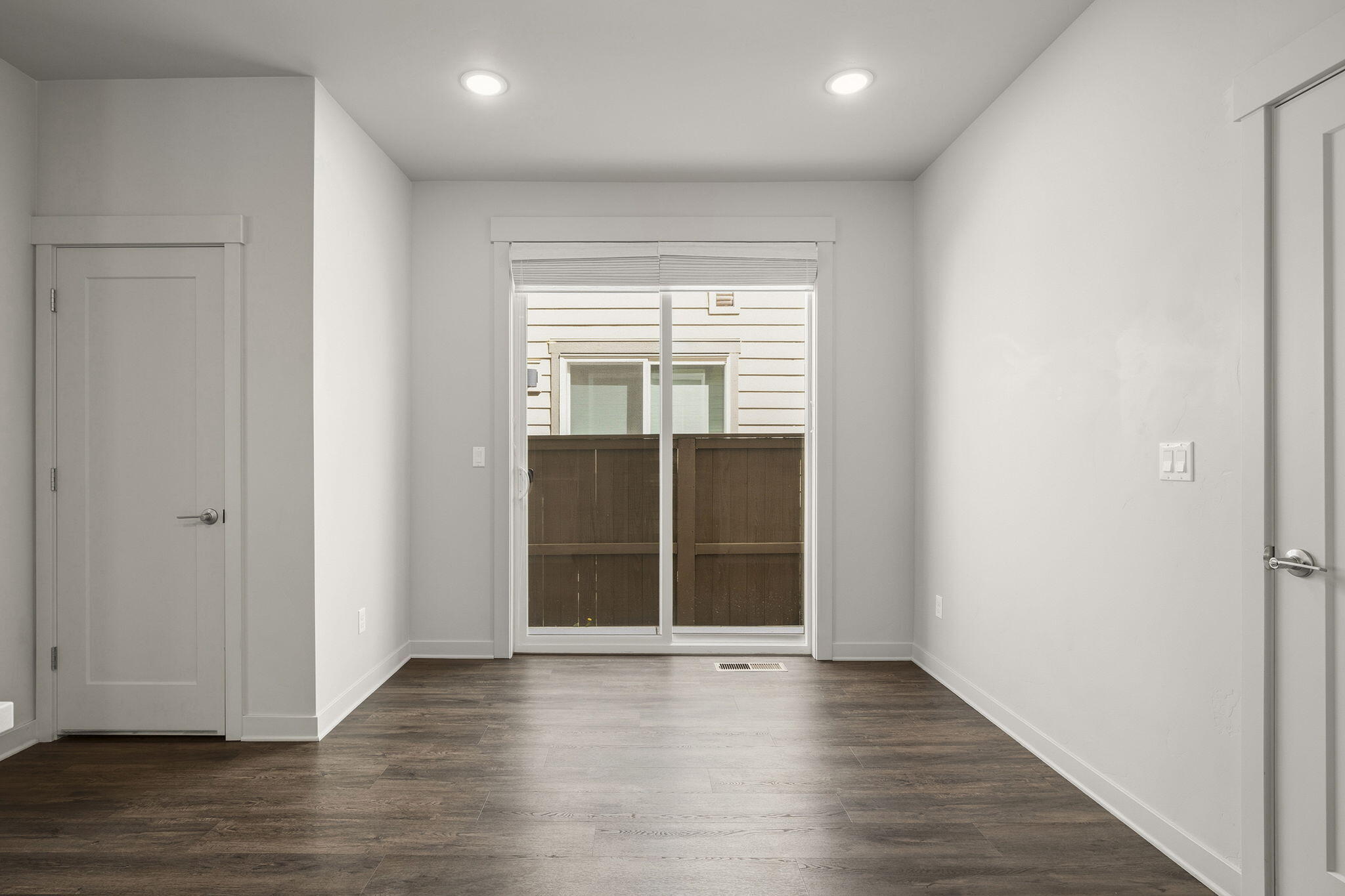 2366 Northeast Victor Place Bend, OR 97701 - Photo 11 of 31 a view of an empty room with wooden floor and a window
