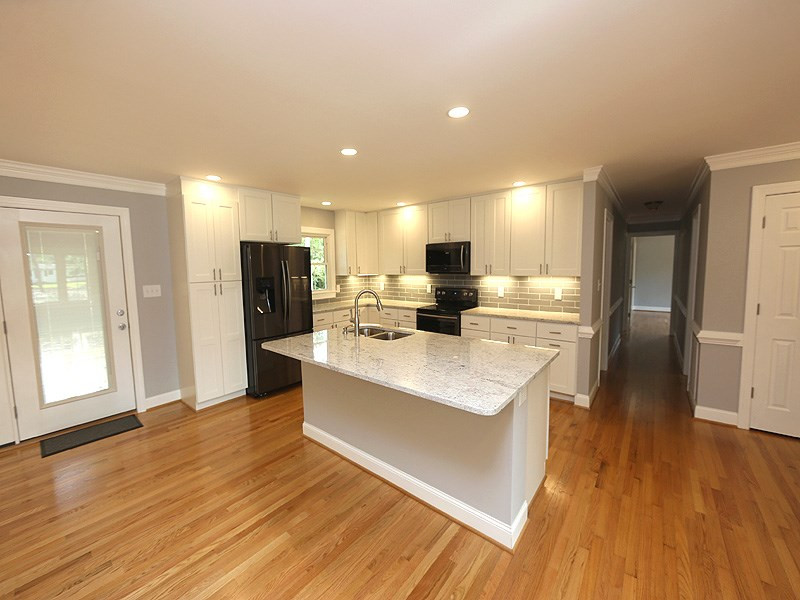 217 Chambers Road Rougemont, NC 27572 - Photo 4 of 19 Fantastic kitchen with beautiful granite, tile backsplash, new Samsung appliances, huge island, and new LED lighting throughout. Kitchen