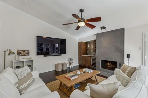 a living room with furniture a fireplace