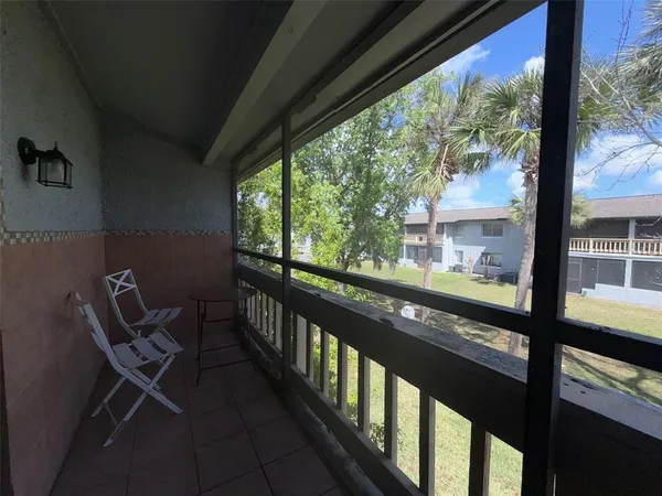 a view of a two chair in the balcony