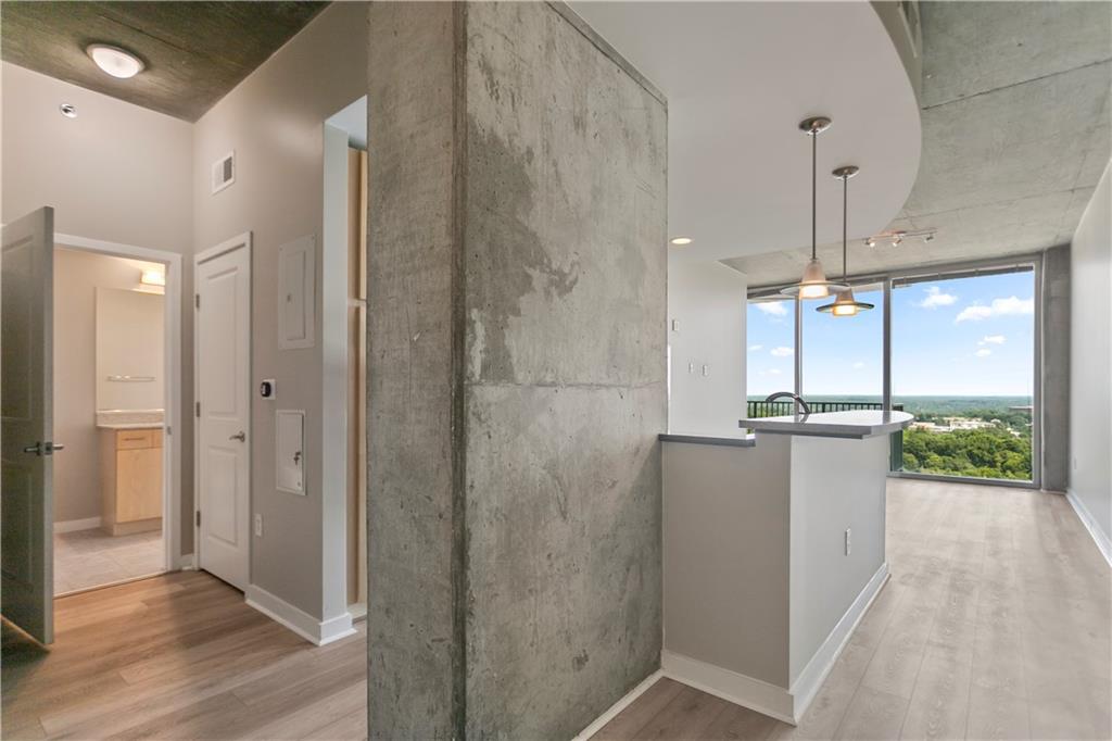 a view of a bathroom with a tub and shower