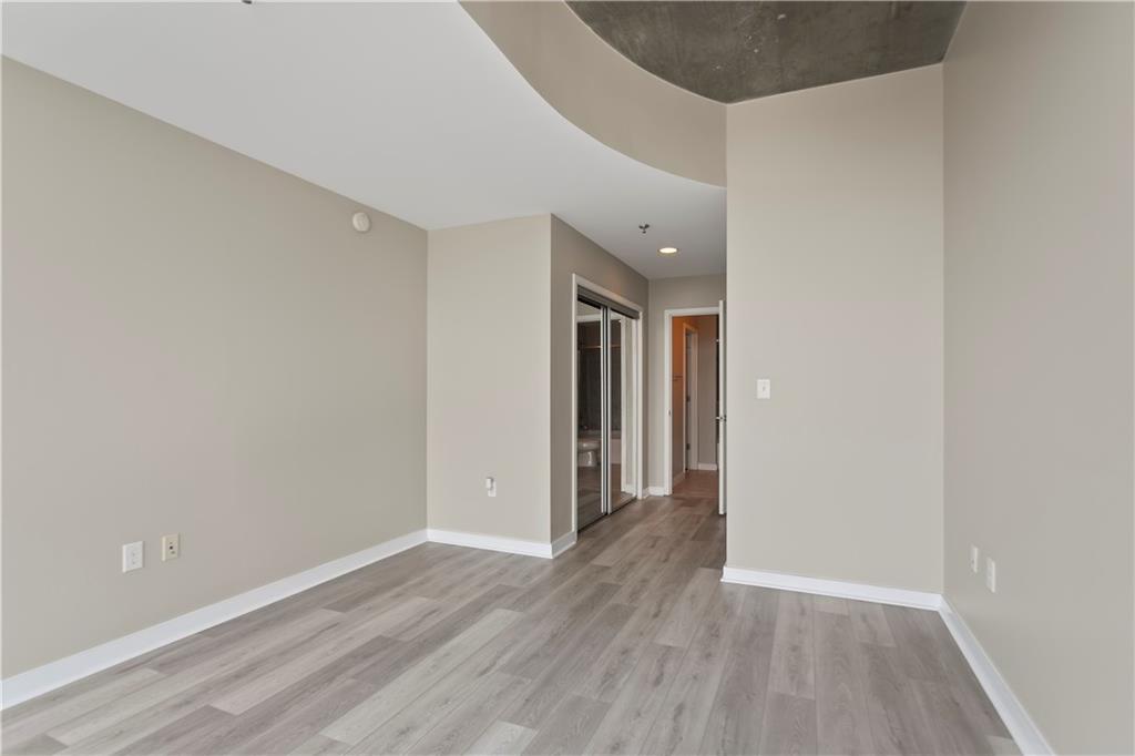 361 17th Street Northwest, Unit 1906 Atlanta, GA 30363 - Photo 11 of 28 a view of hallway with wooden floor