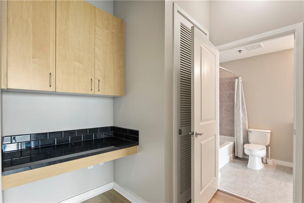 361 17th Street Northwest, Unit 1906 Atlanta, GA 30363 - Photo 15 of 28 a view of a bathroom with a sink and a mirror