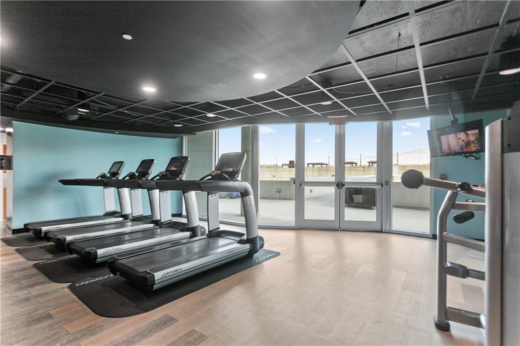 361 17th Street Northwest, Unit 1906 Atlanta, GA 30363 - Photo 21 of 28 a view of a room with gym equipment