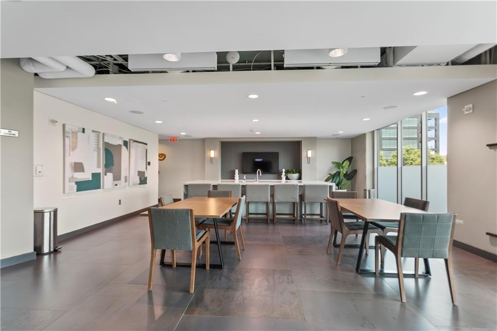361 17th Street Northwest, Unit 1906 Atlanta, GA 30363 - Photo 23 of 28 a view of a dining area with furniture and window